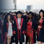 Graduates in academic gowns and caps