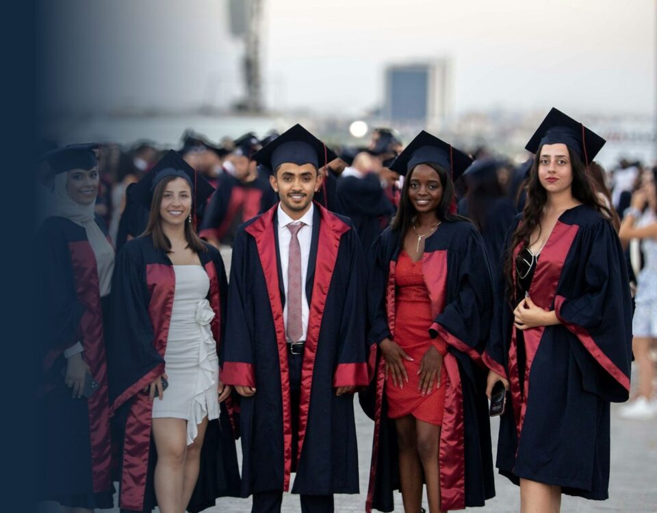 Graduates in academic gowns and caps