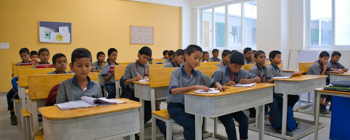Students in a modern, well-lit school classroom in India