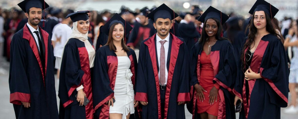 Graduates in academic gowns and caps