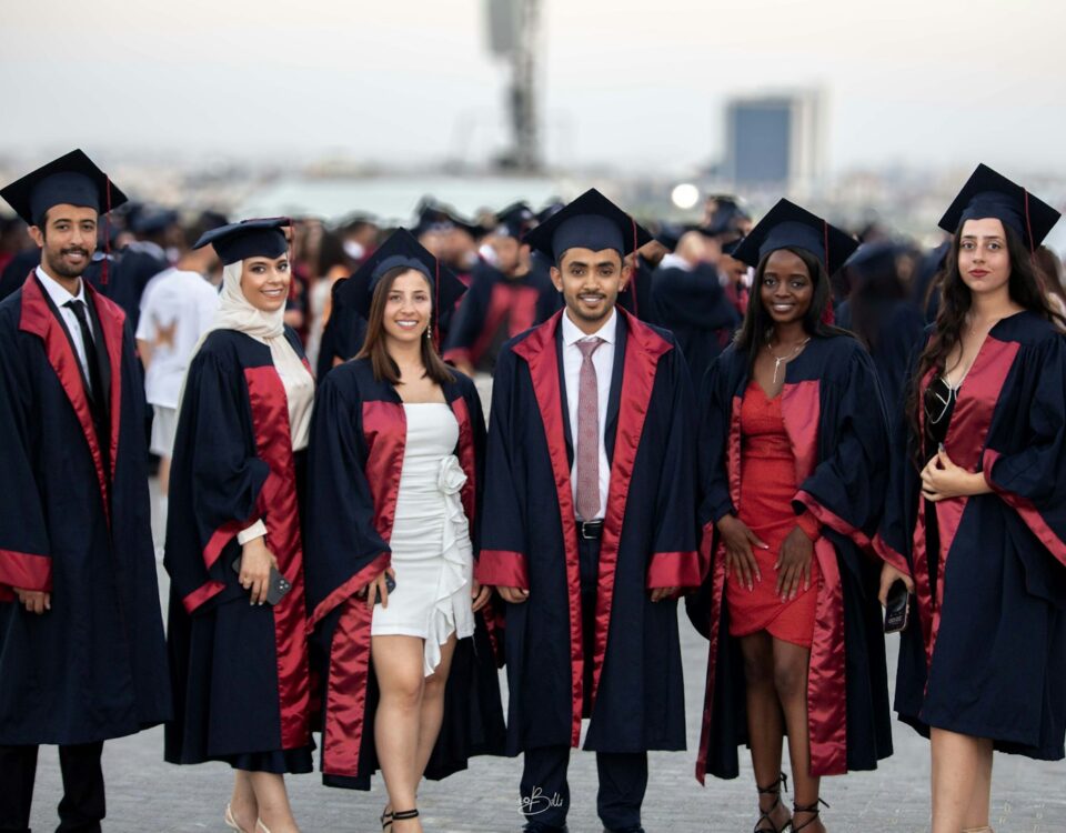 Graduates in academic gowns and caps